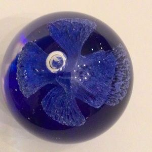 Glass paperweight with interior blue flower 2”